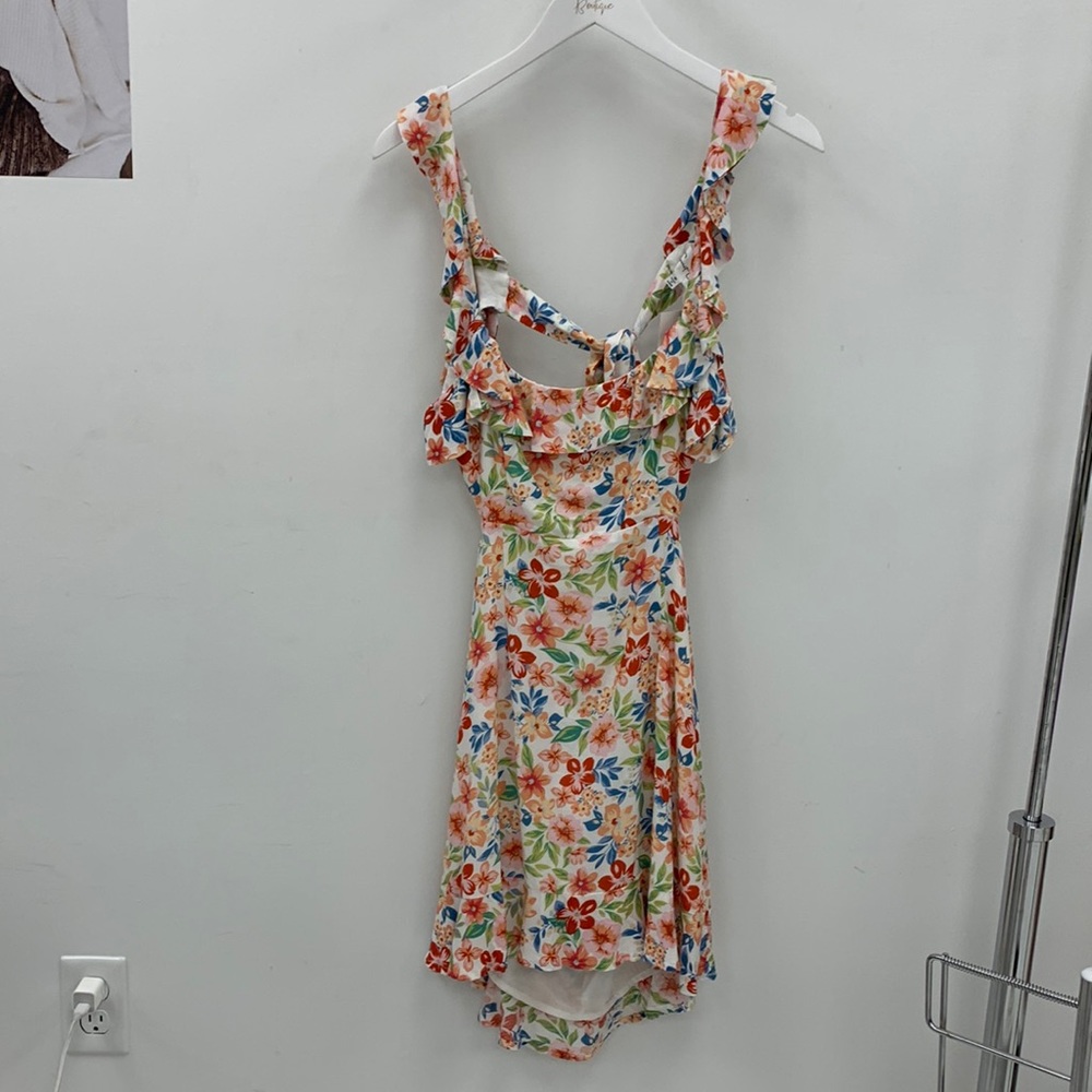 Brand new multi colored flower printed dress with back tie and open back